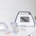 LymphaTouch® negative pressure therapy device with a range of treatment heads.